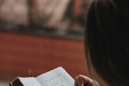 person journaling morning light