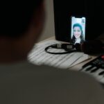 over the shoulder video call couple tablet