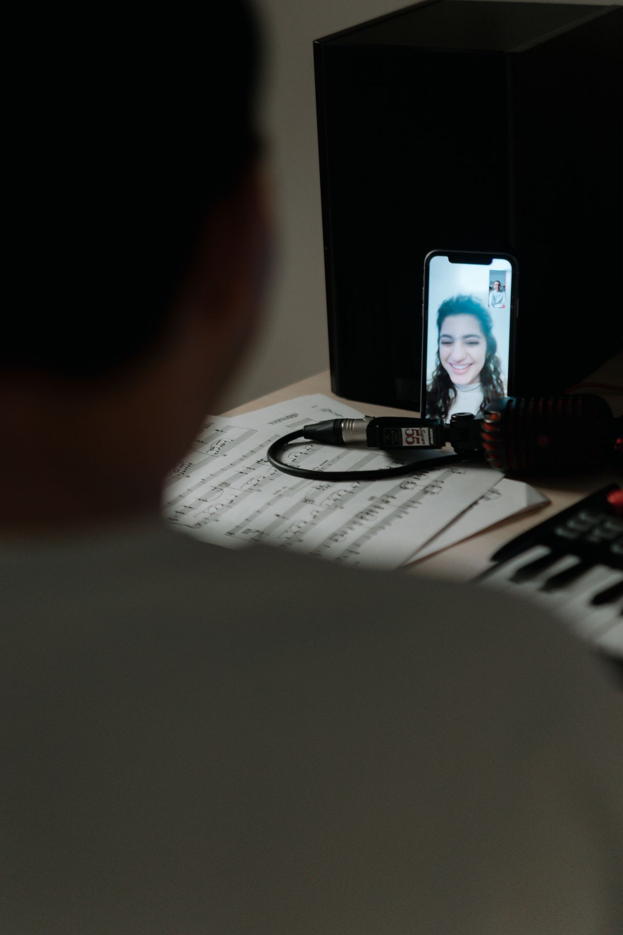 over the shoulder video call couple tablet