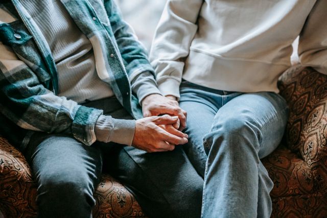 couple holding hands close up texture couch