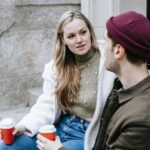 couple talking porch coffee cozy