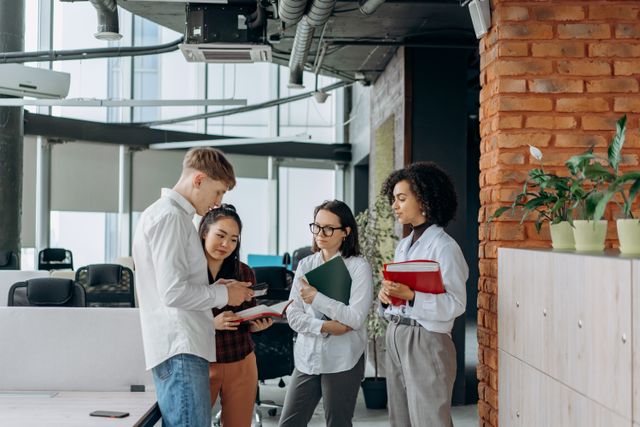 diverse team in a bright, modern office space to illustrate how personality types influence professional dynamics and collaboration.