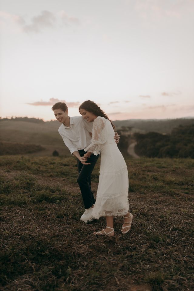 couple walking outdoors laughing dynamic golden hour