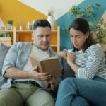 couple talking seriously living room couch