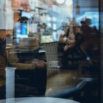 couple deep conversation coffee shop cozy