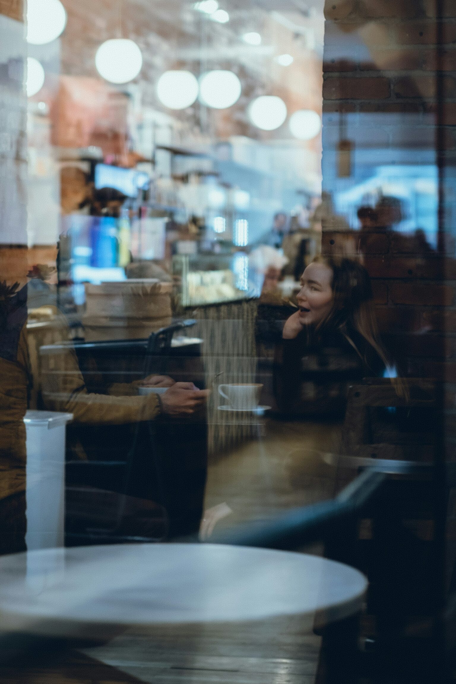couple deep conversation coffee shop cozy
