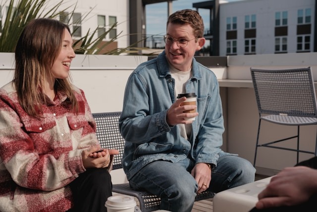 couple laughing outdoor social gathering