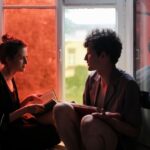couple reading book cozy window seat